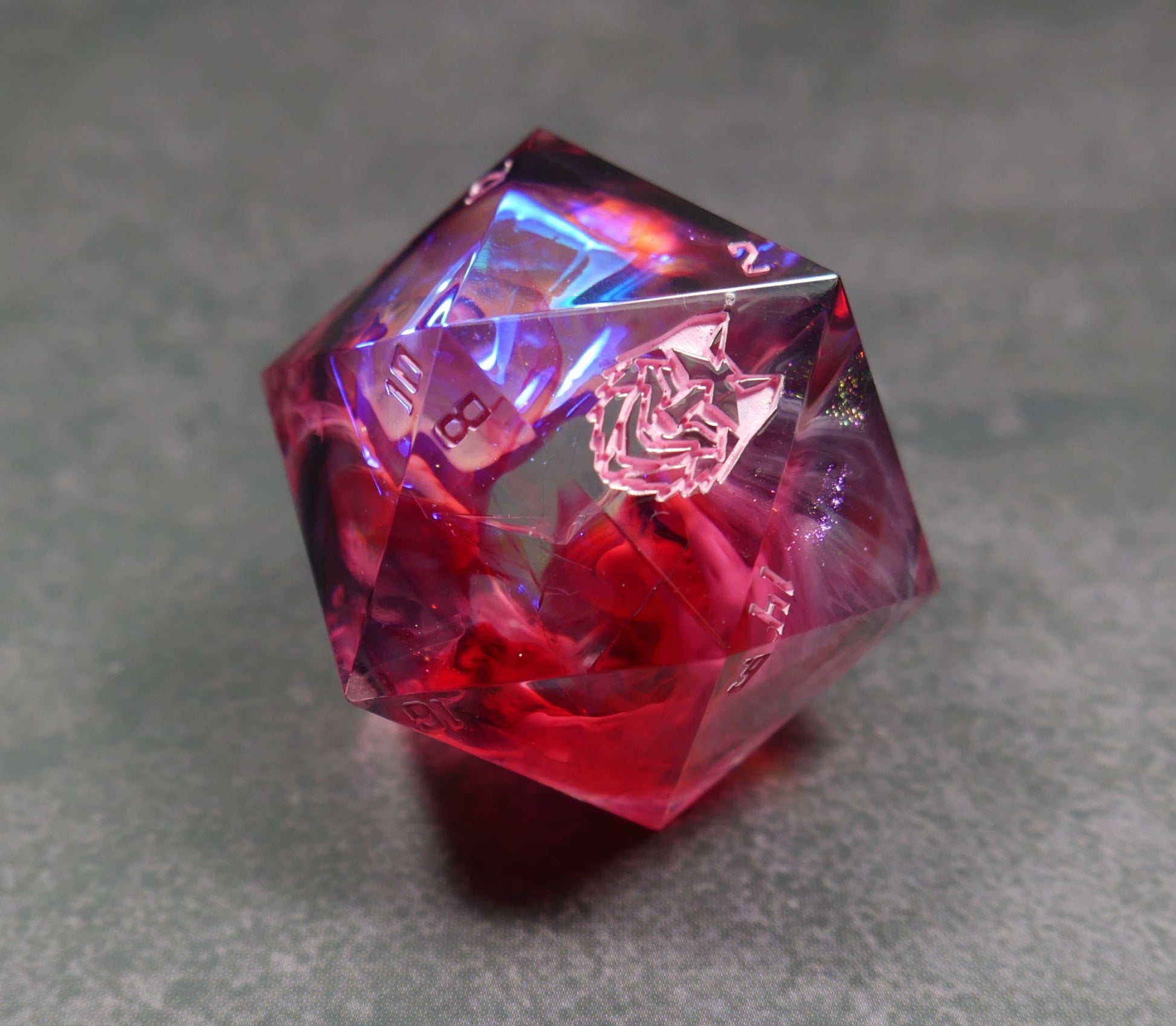 gorgeous smokey red d20 die with etheral tones 